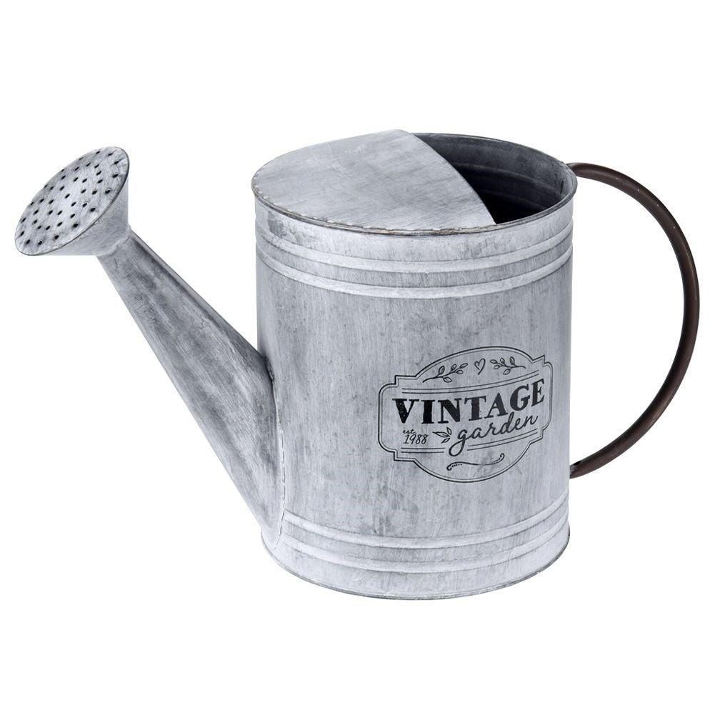Unique metal watering can for garden decoration and flower arrangements