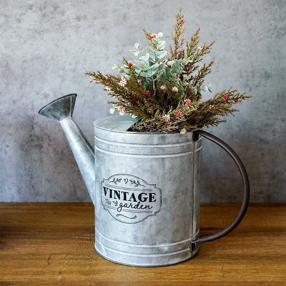 Unique metal watering can for garden decoration and flower arrangements