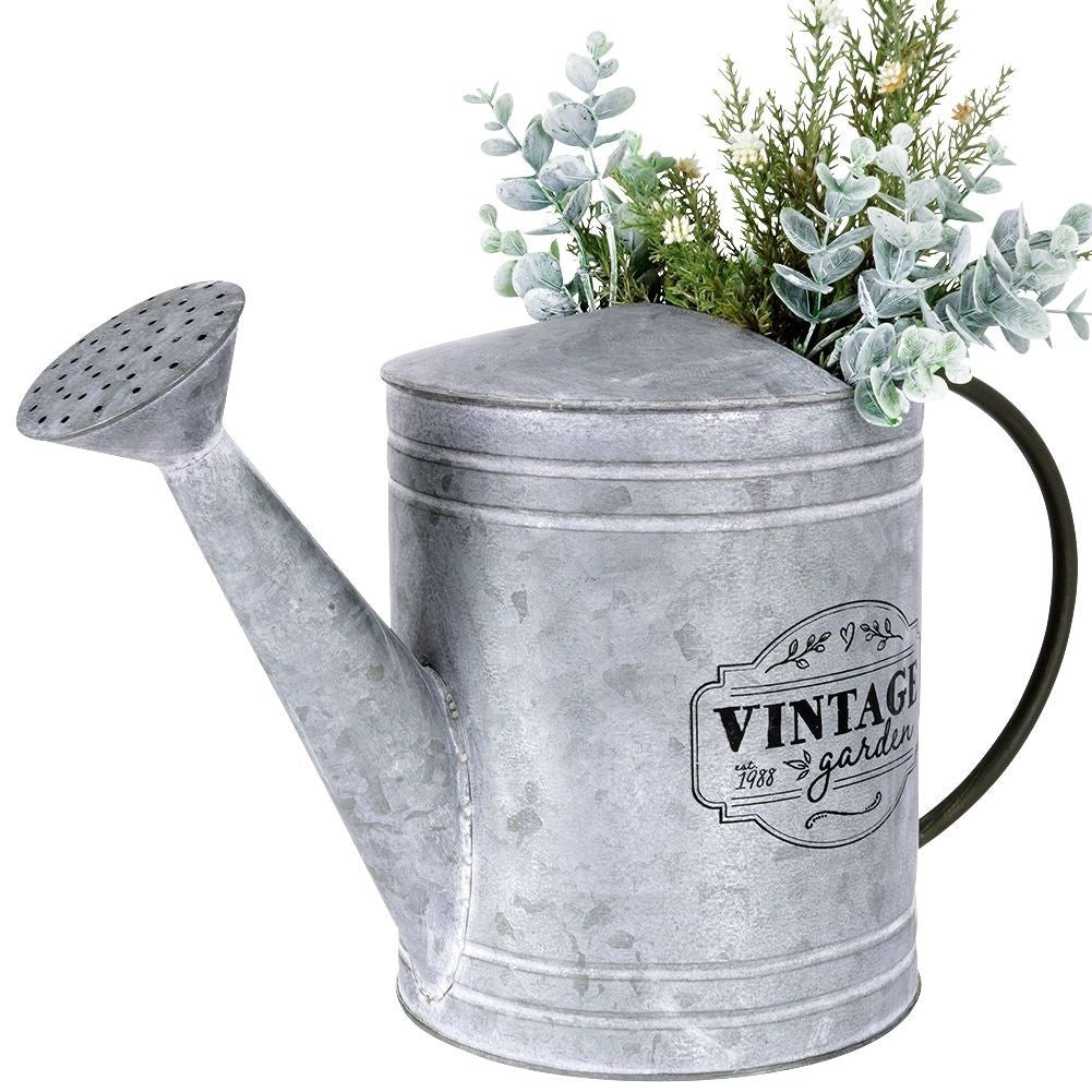 Unique metal watering can for garden decoration and flower arrangements