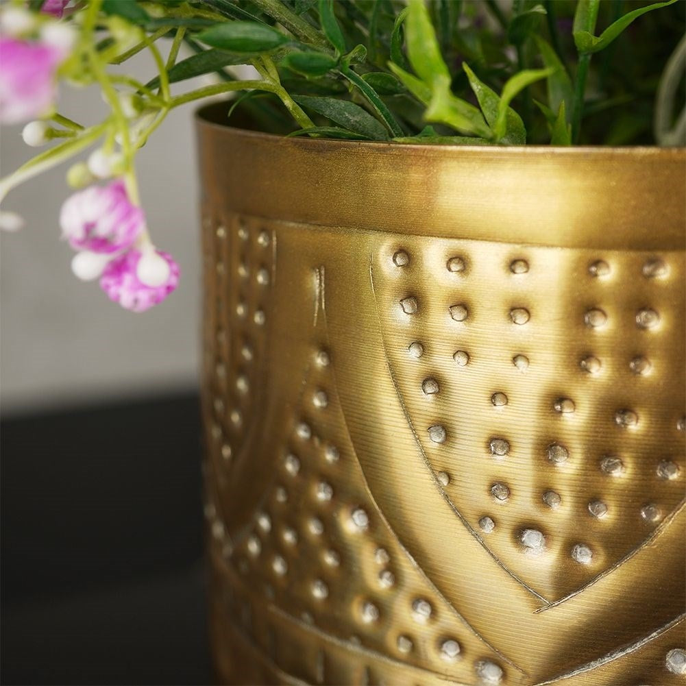 Unique plant pot in hammered brass with an eye-catching design
