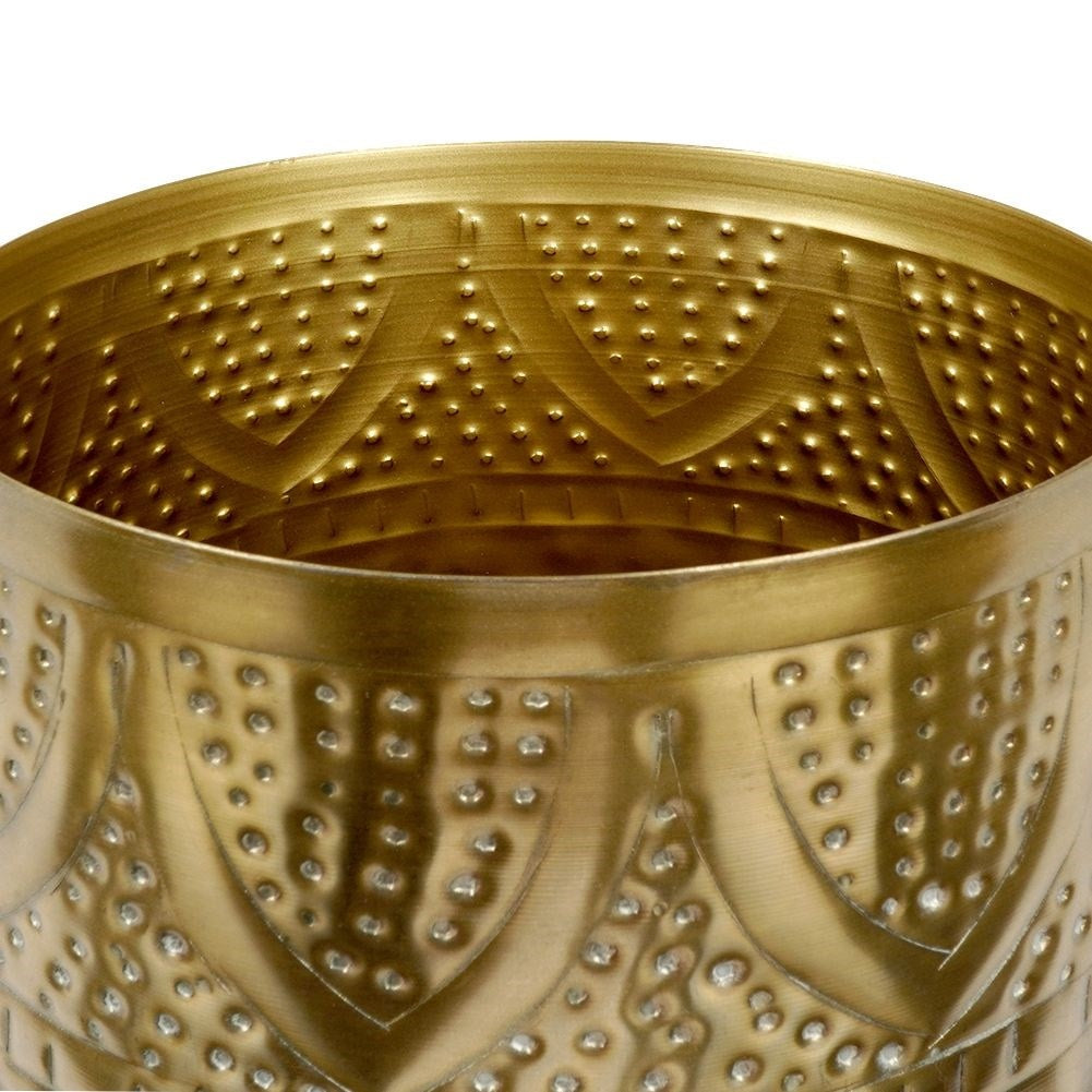 Unique plant pot in hammered brass with an eye-catching design