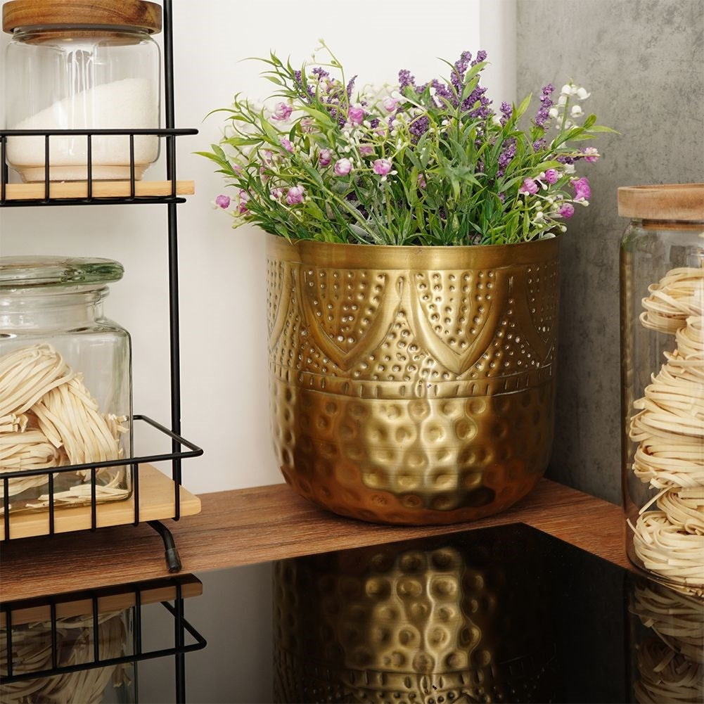 Unique plant pot in hammered brass with an eye-catching design