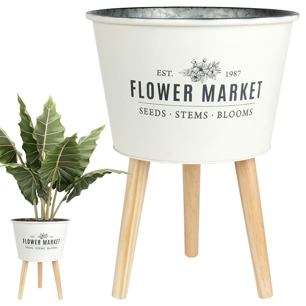Unique three-legged pot in light gray zinc for plants