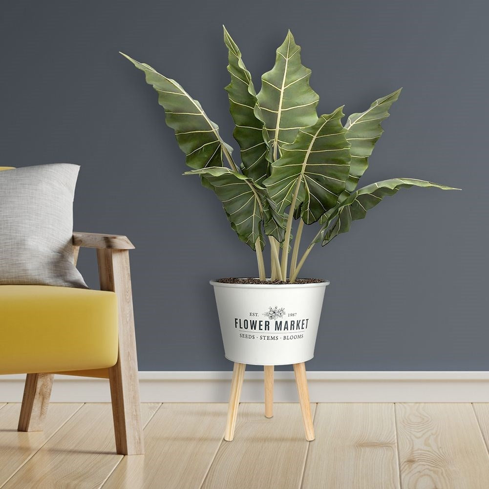 Unique three-legged pot in light gray zinc for plants