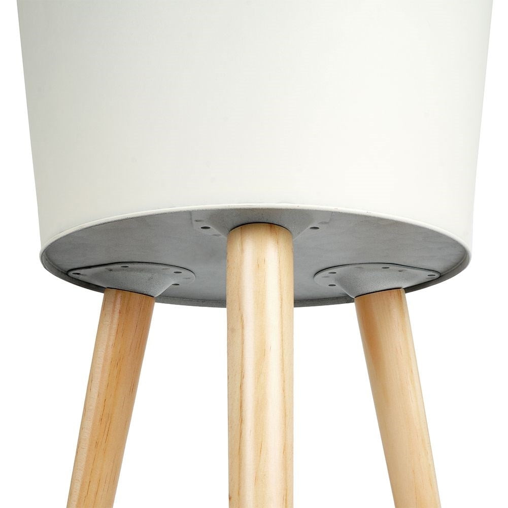Unique three-legged pot in light gray zinc for plants