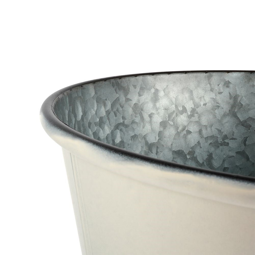 Unique three-legged pot in light gray zinc for plants