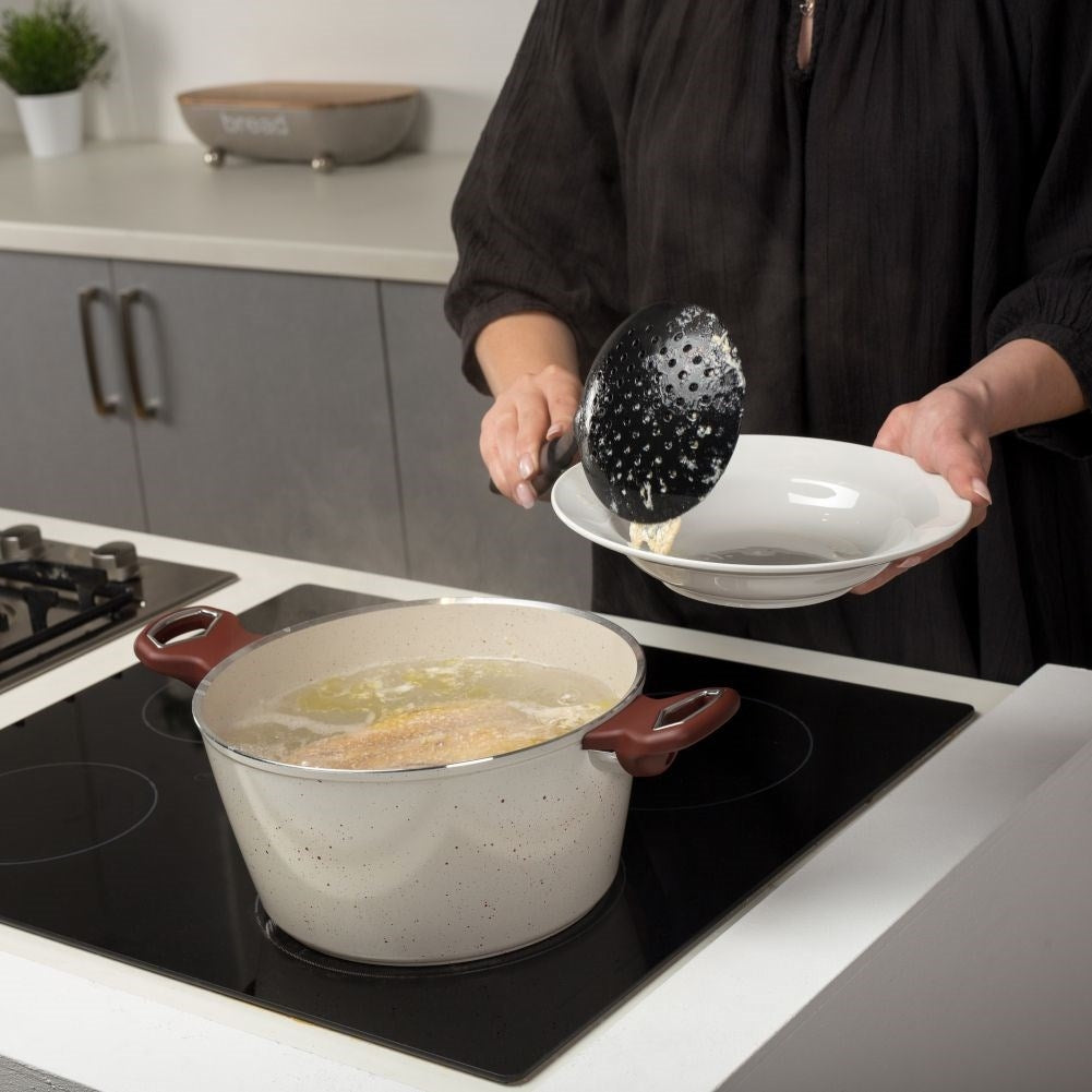 Universal kitchen ladle for pasta, dumplings and dumplings.