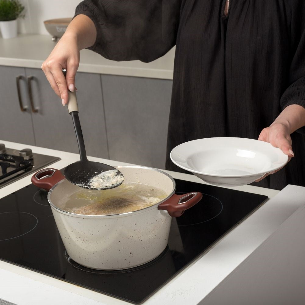 Universal kitchen ladle for pasta, dumplings and dumplings.