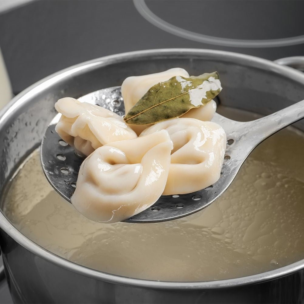 Universal kitchen spoon in stainless steel for draining food