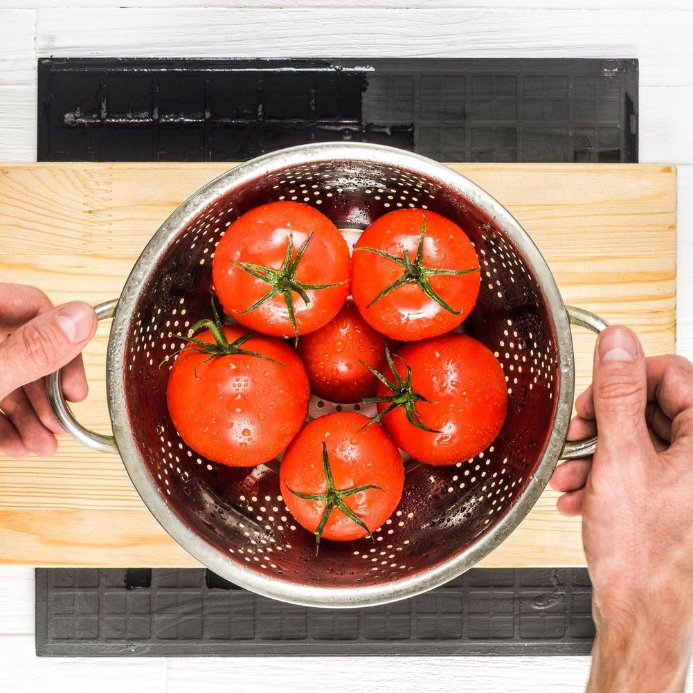 Universal kitchen strainer in bowl shape with two stainless steel handles