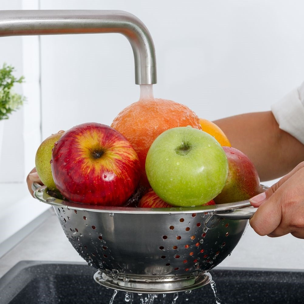 Universal kitchen strainer in bowl shape with two stainless steel handles
