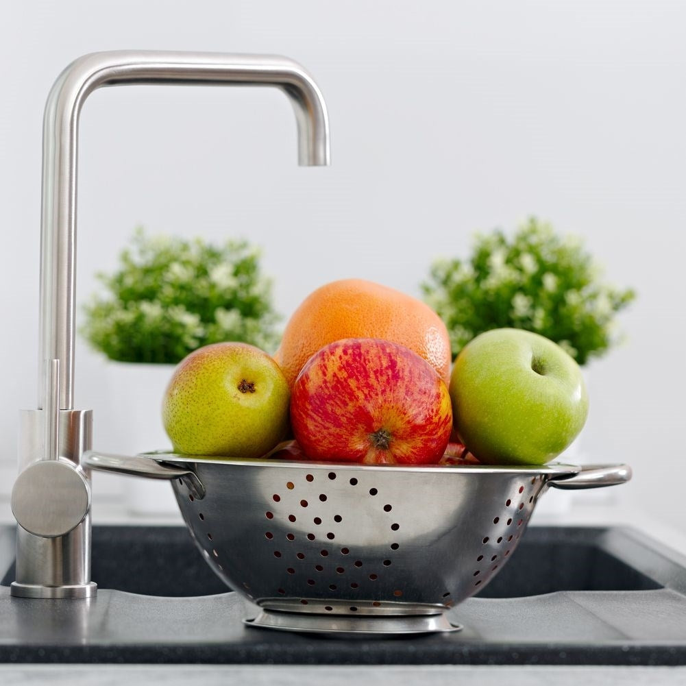 Universal kitchen strainer in bowl shape with two stainless steel handles