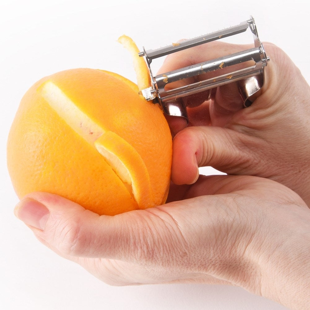 Vegetable peeler with double blades for patterns and slices