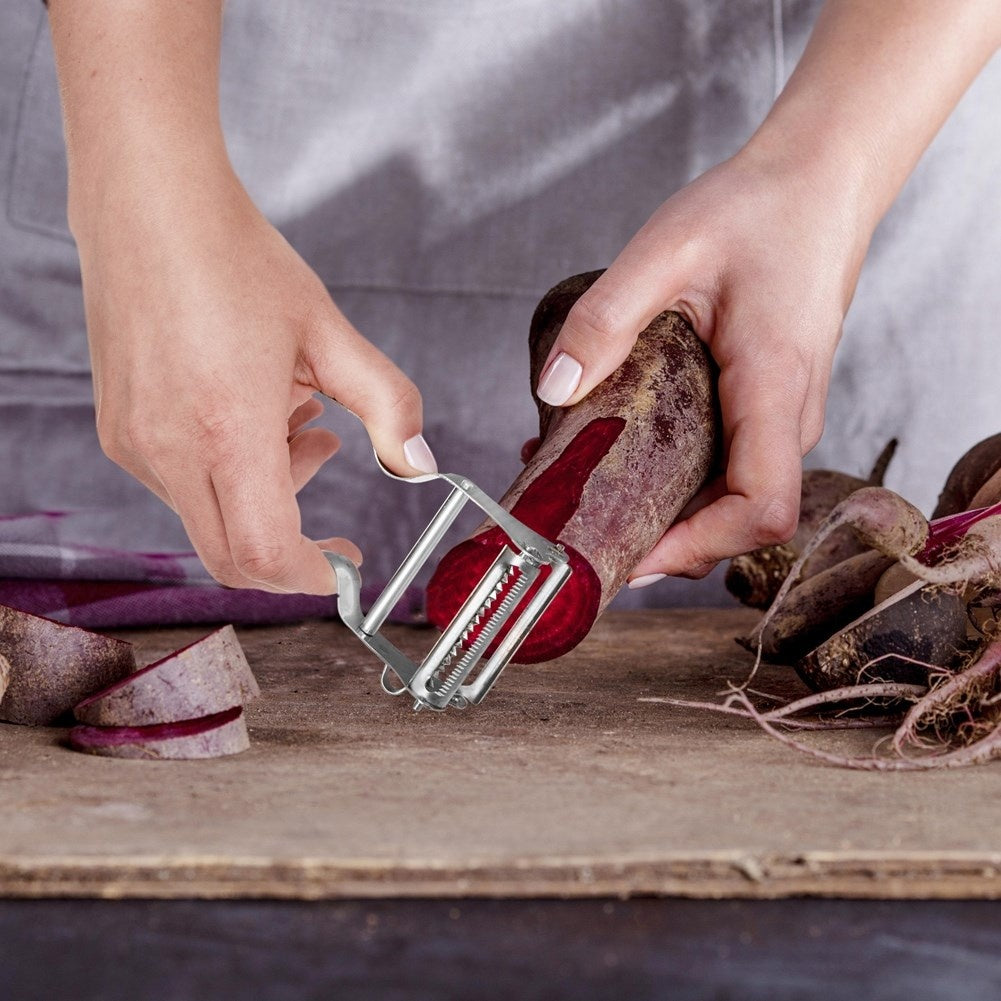 Vegetable peeler with double blades for peeling and shredding