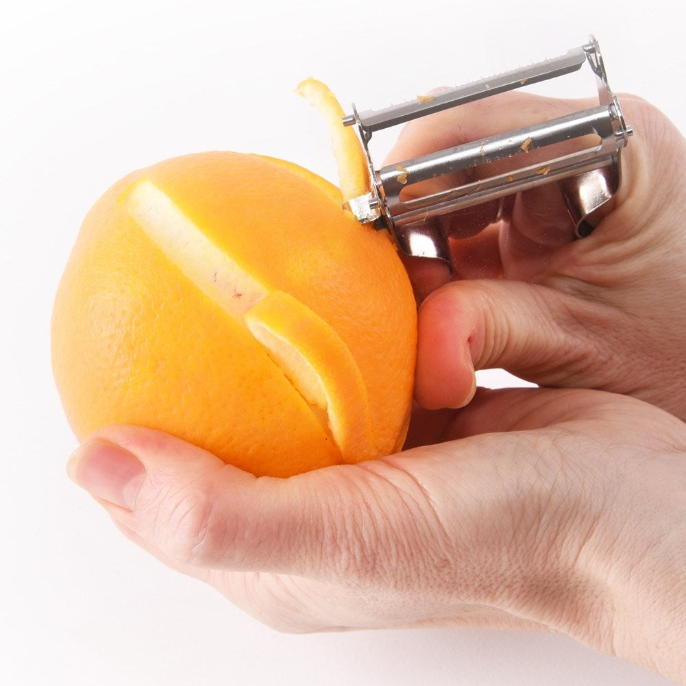 Vegetable peeler with double blades for peeling and shredding