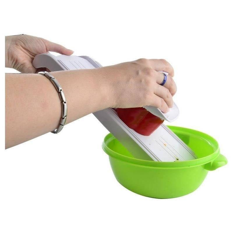 Vegetable slicer with replaceable inserts and steel blade