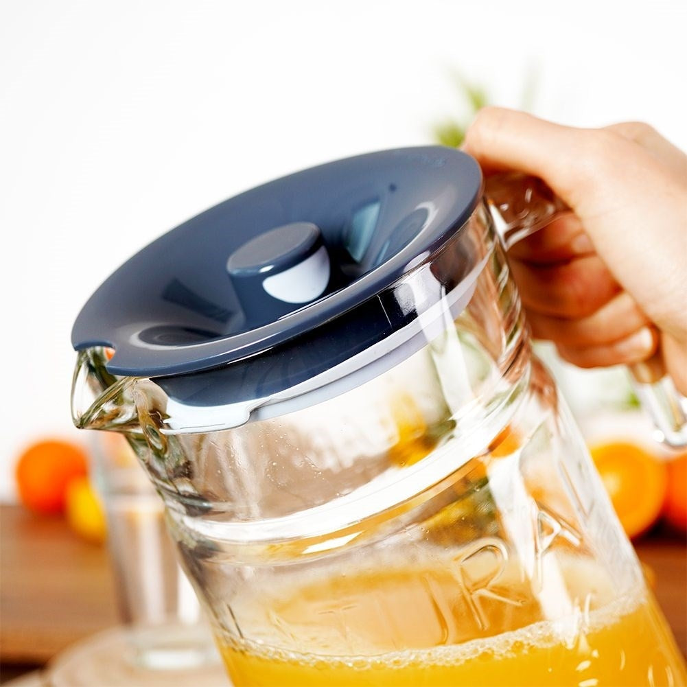 Versatile glass jug with lid and spout for drinks