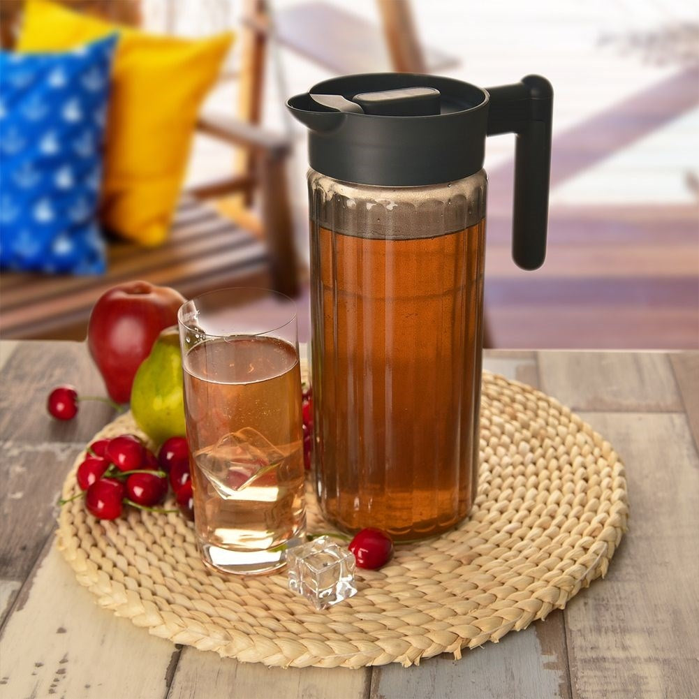 Versatile glass jug with lid, spout and comfortable handle