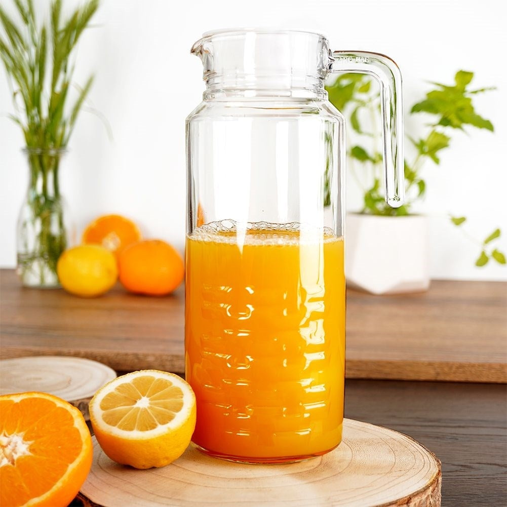 Versatile glass jug with lid, spout and comfortable handle