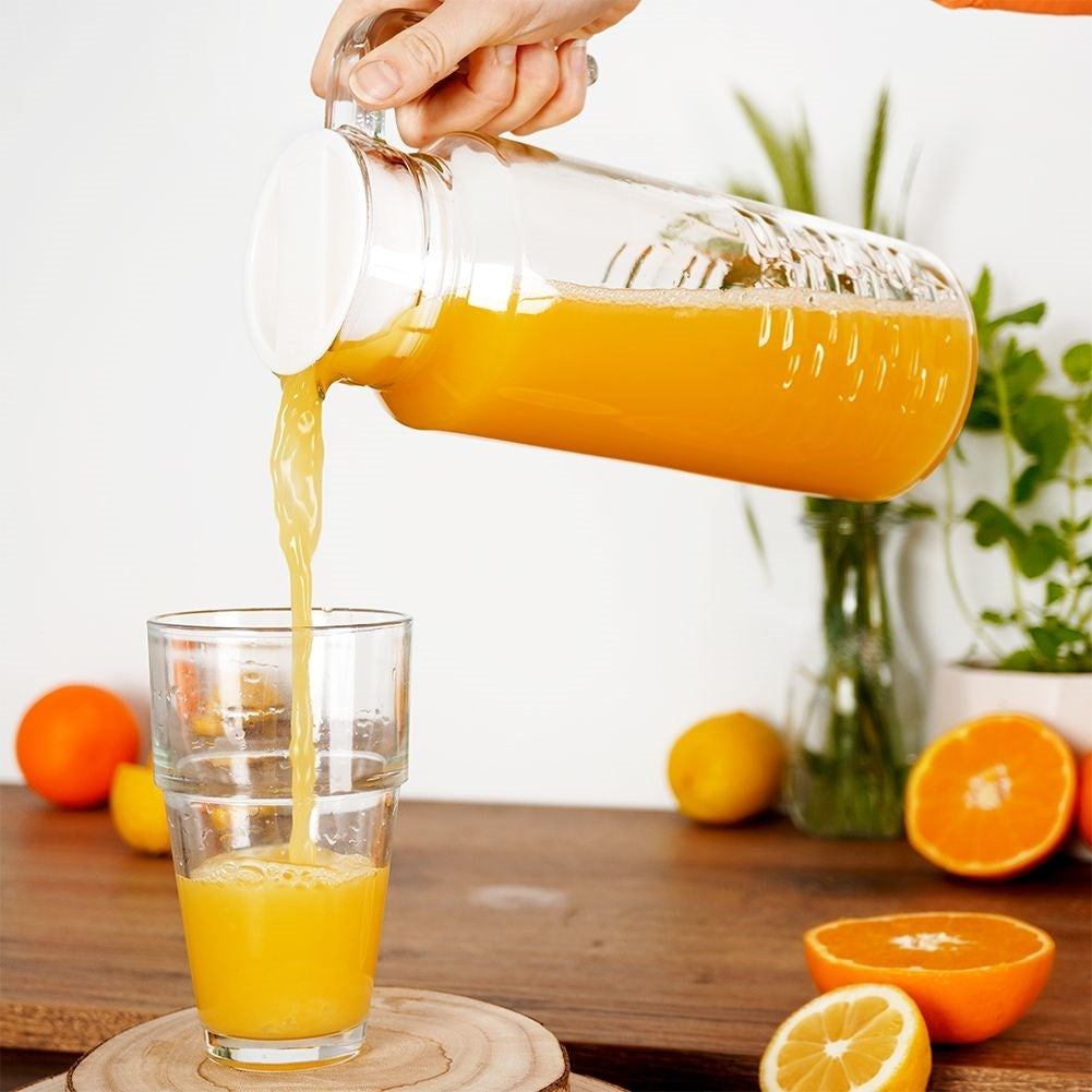 Versatile glass jug with lid, spout and comfortable handle