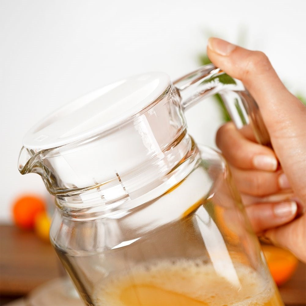 Versatile glass jug with lid, spout and comfortable handle
