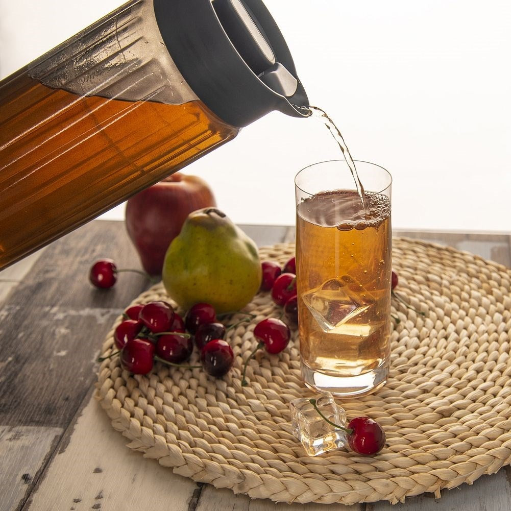 Versatile glass jug with lid, spout and comfortable handle