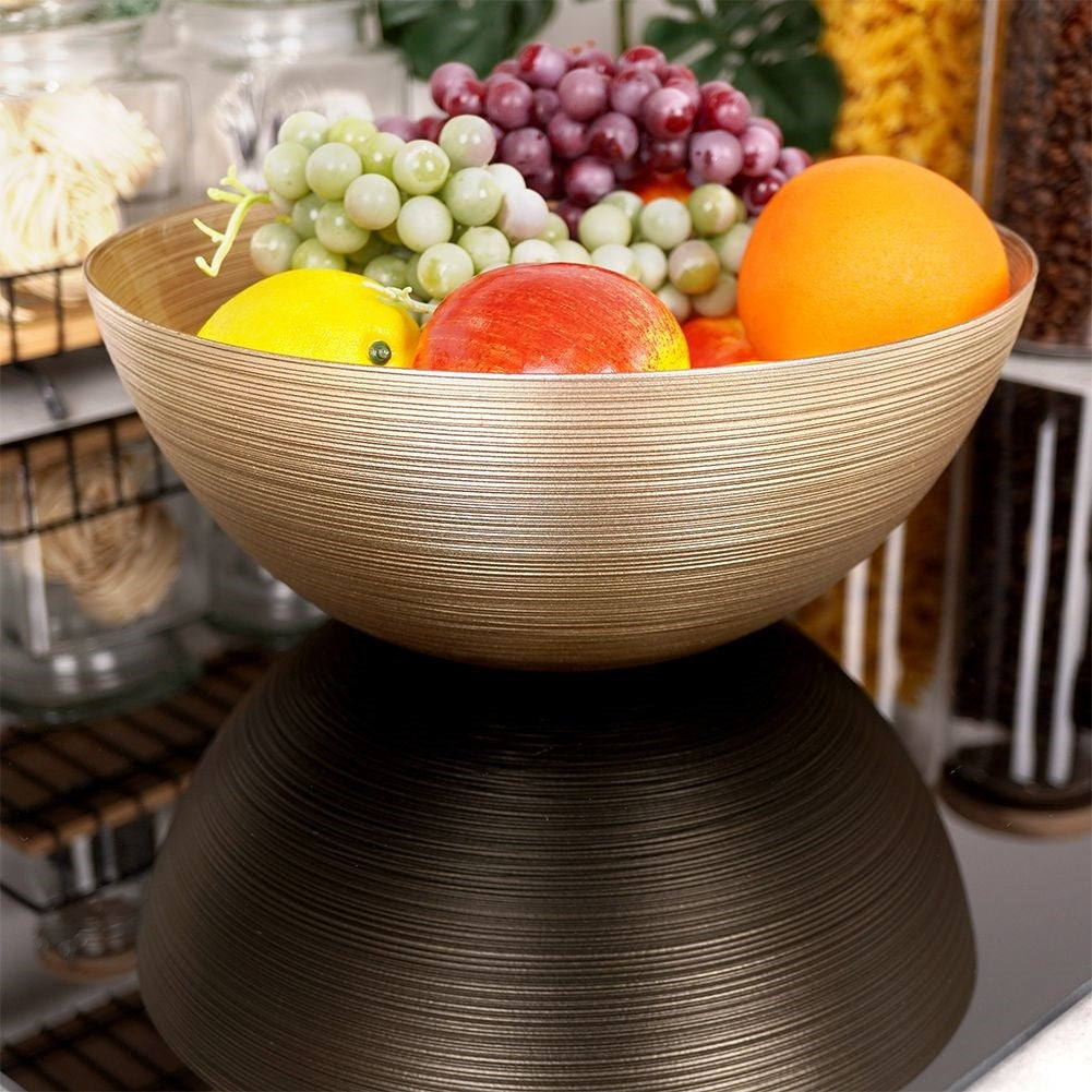 Versatile golden glass bowl for salad and snacks