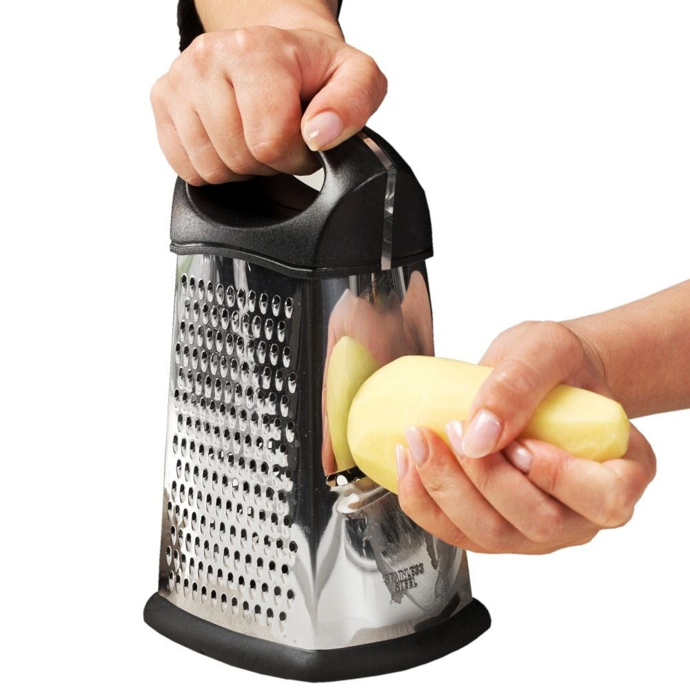 Versatile kitchen grater with four blades for different tasks