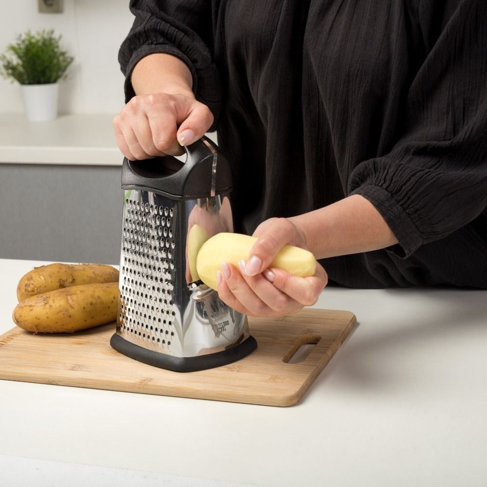 Versatile kitchen grater with four blades for different tasks