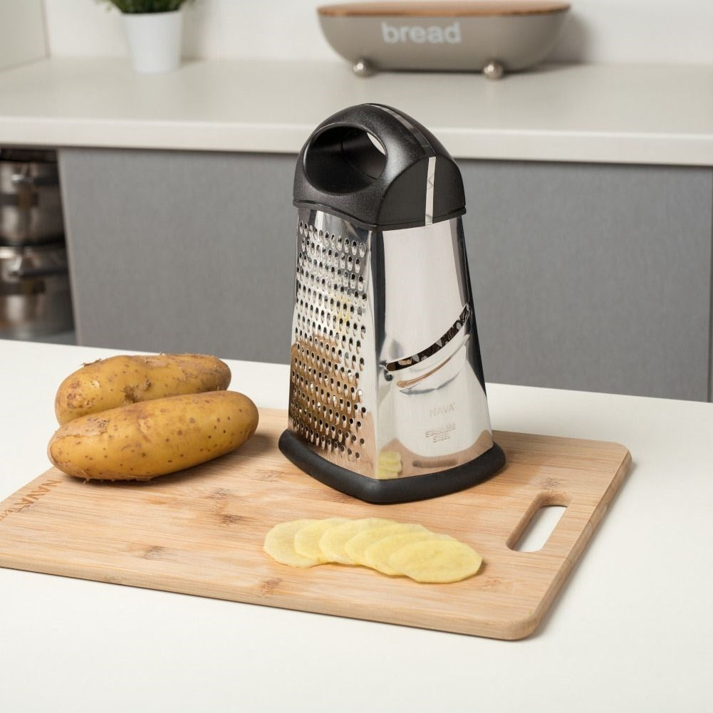 Versatile kitchen grater with four blades for different tasks