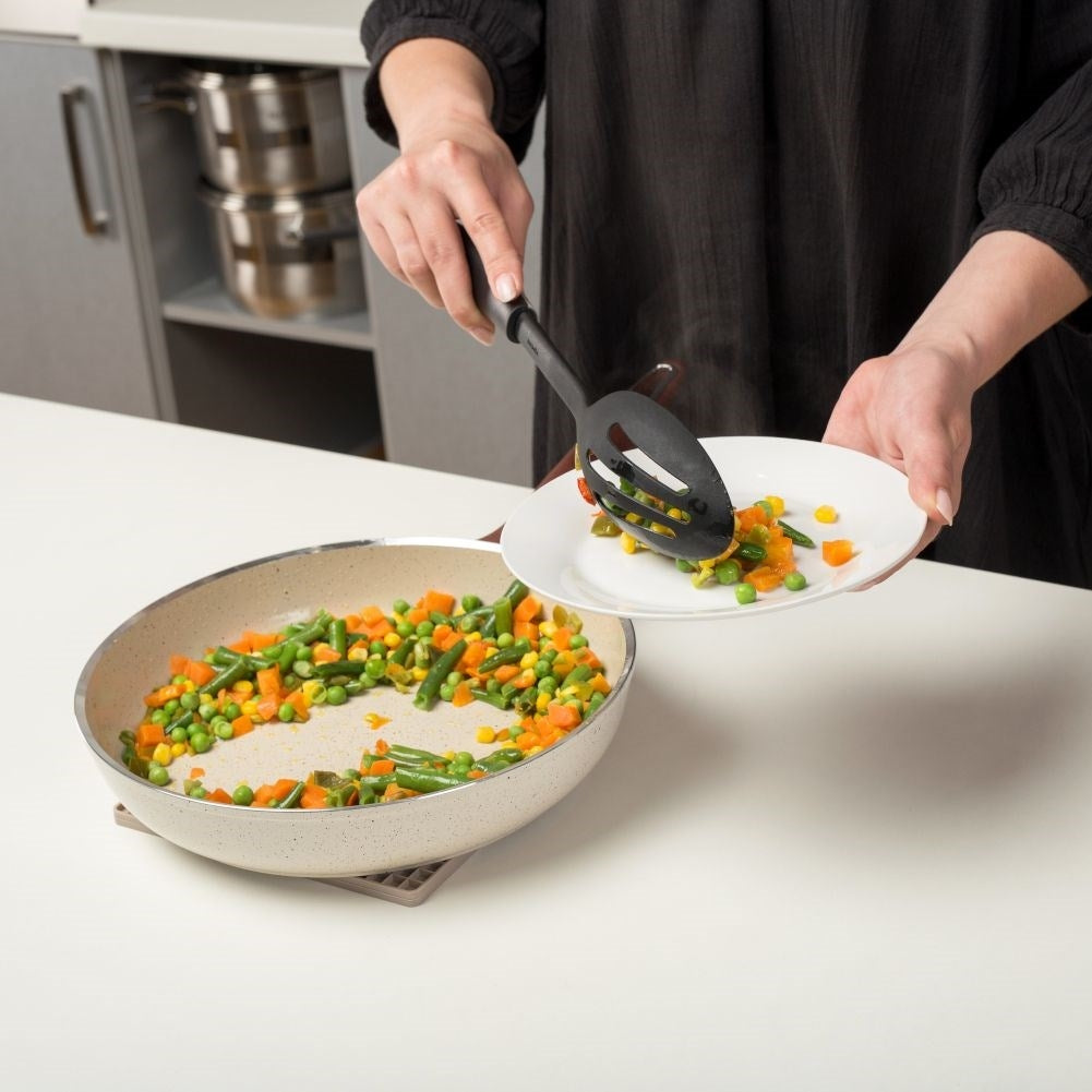 Versatile kitchen ladle in durable thermoplastic for draining