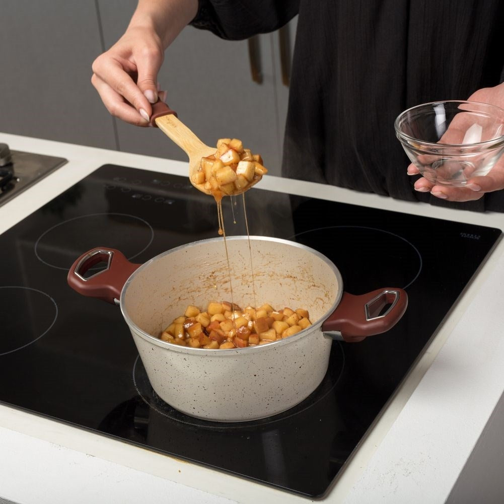 Versatile kitchen spoon in bamboo and silicone for serving