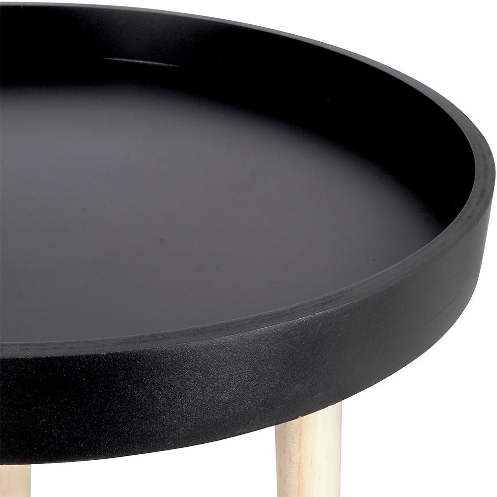 Versatile wooden coffee table with black table top and three legs