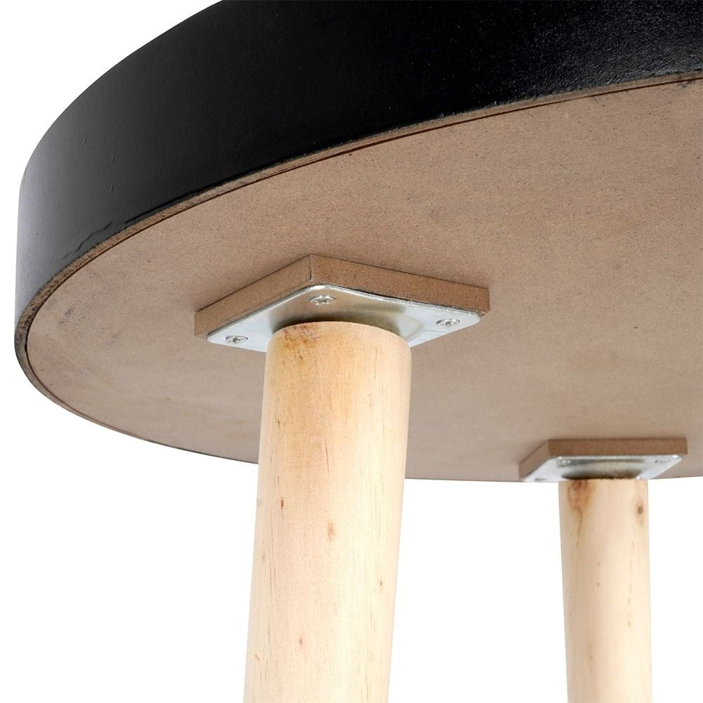 Versatile wooden coffee table with black table top and three legs