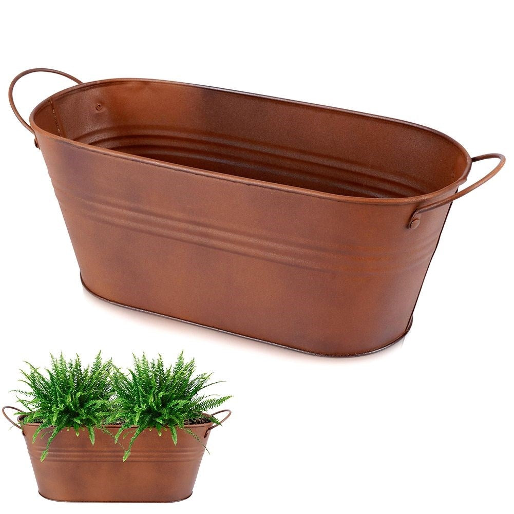Vintage style oblong metal pot with a rusty finish