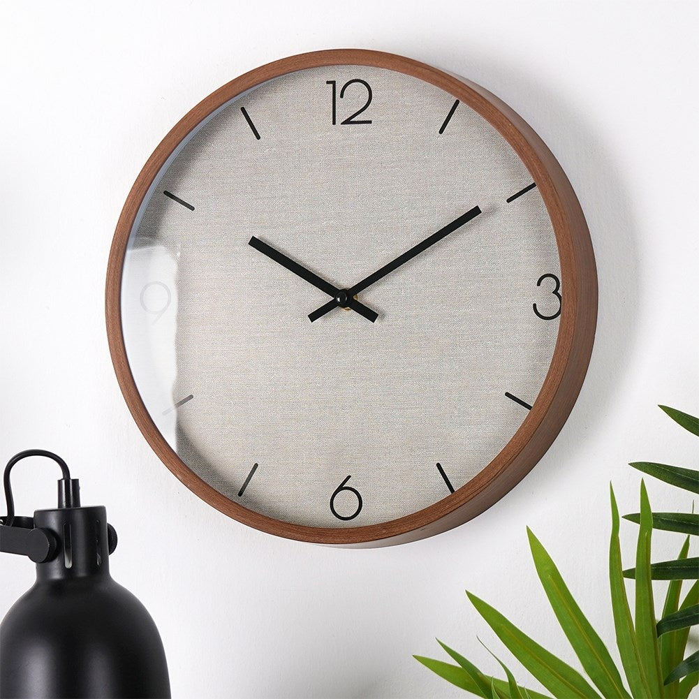 Wall clock with wooden finish and black numbers