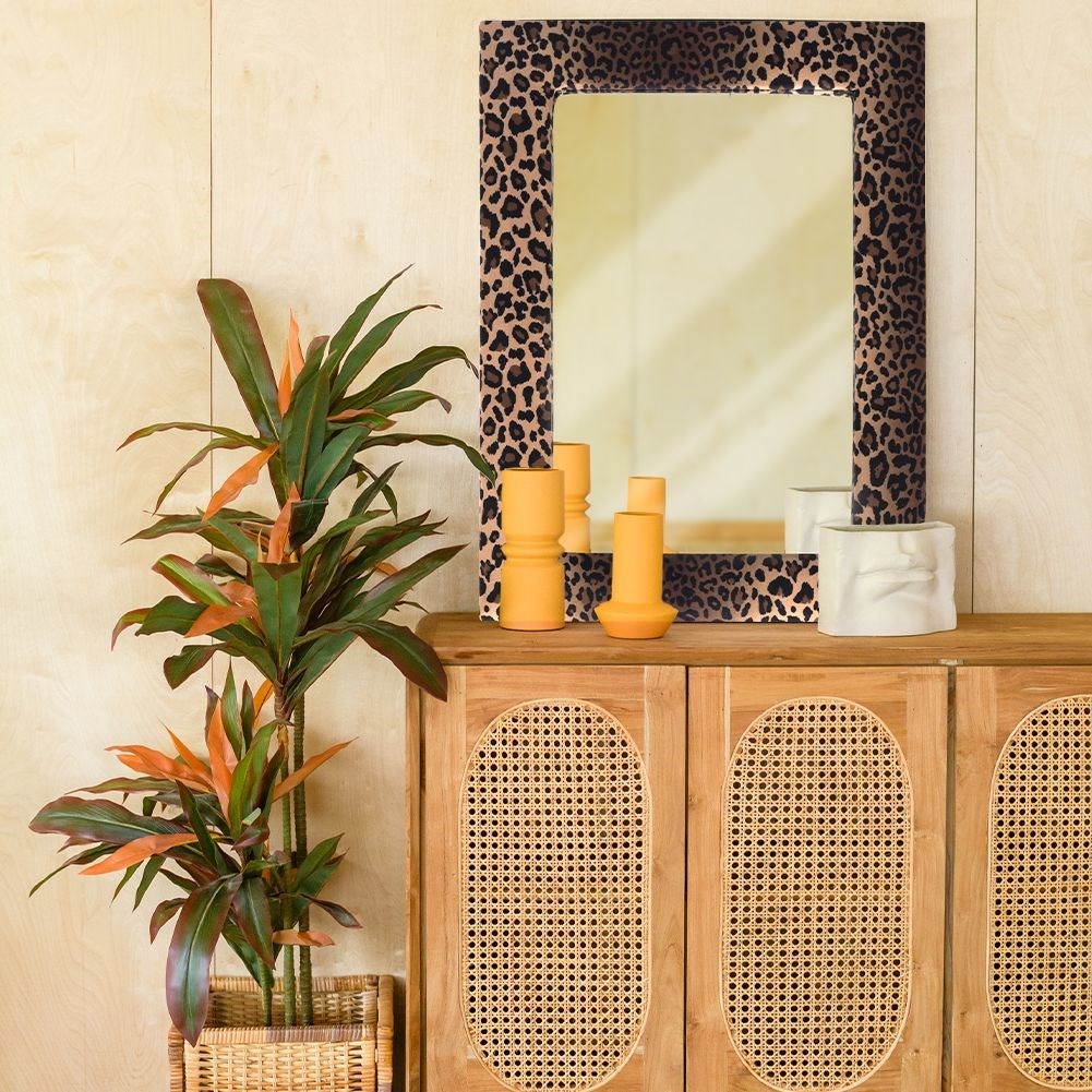 Wall mirror in wooden frame with velvet and leopard pattern