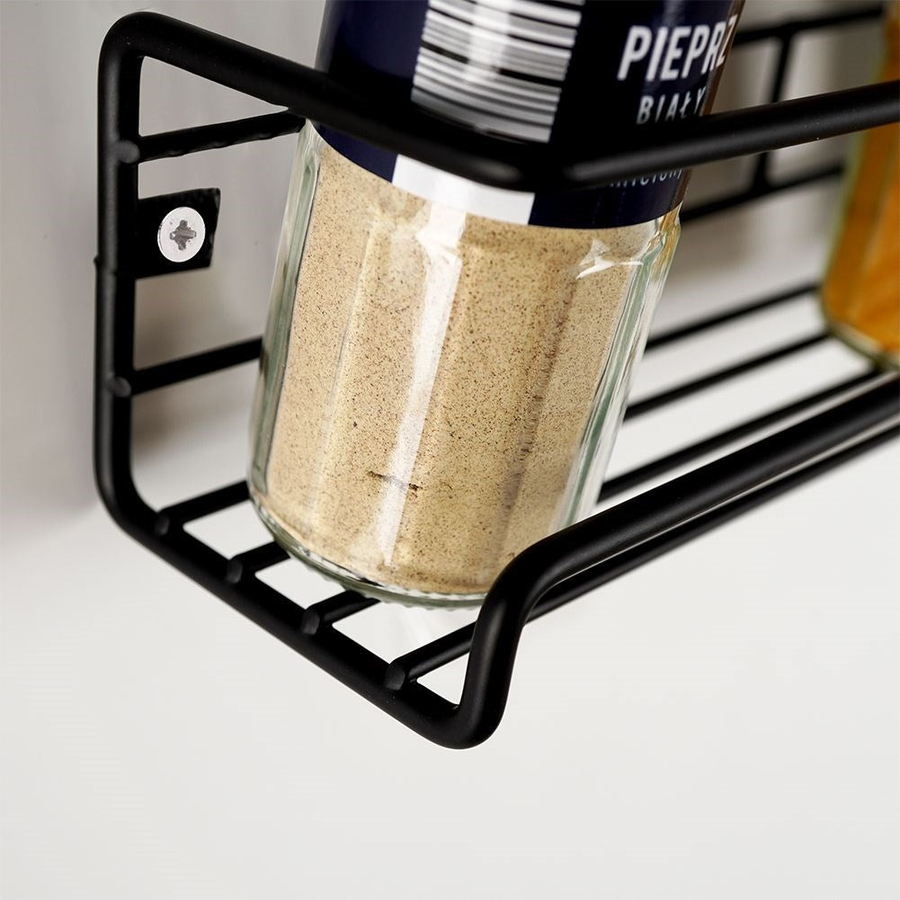 Wall-mounted black metal shelf for spices and cosmetics