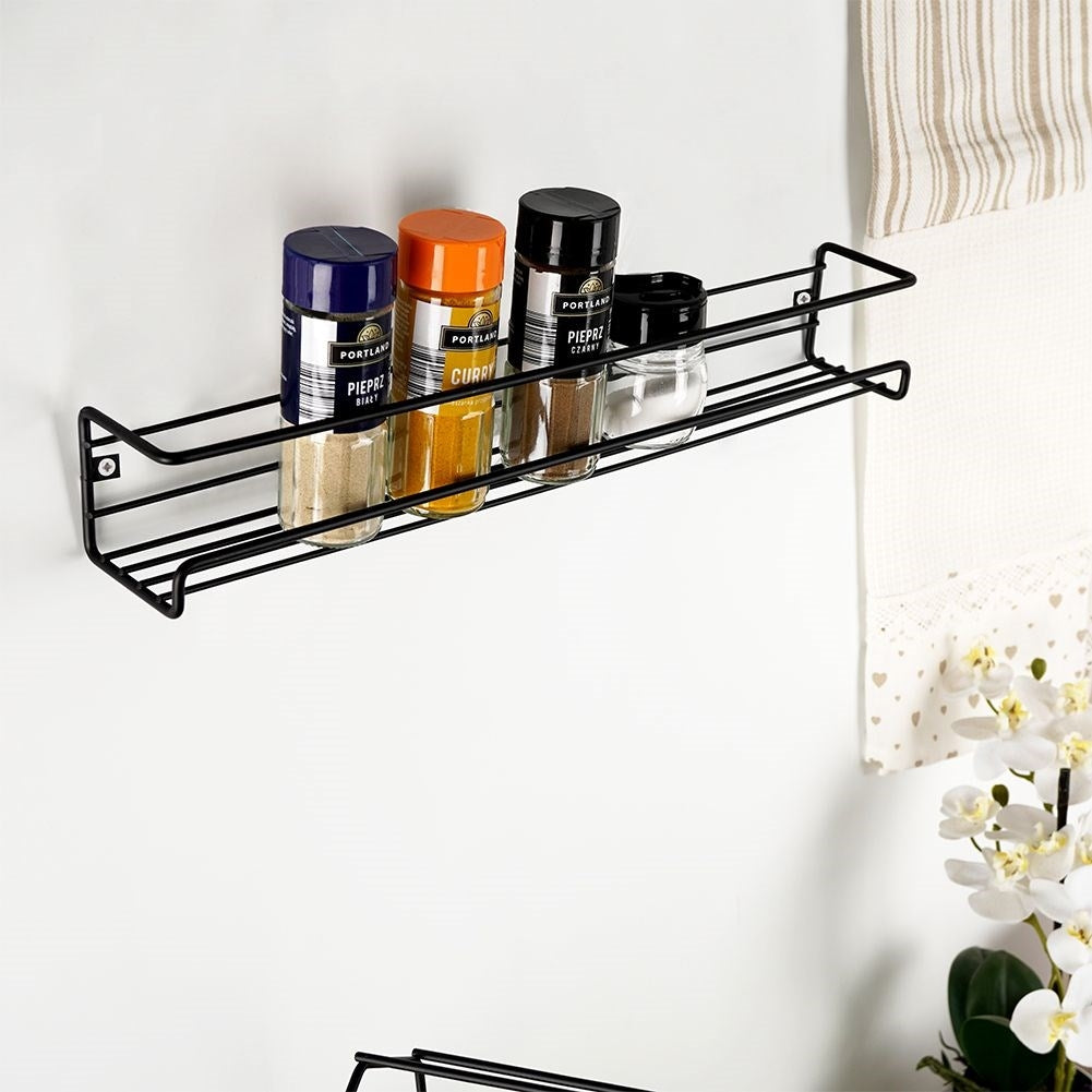 Wall-mounted black metal shelf for spices and cosmetics