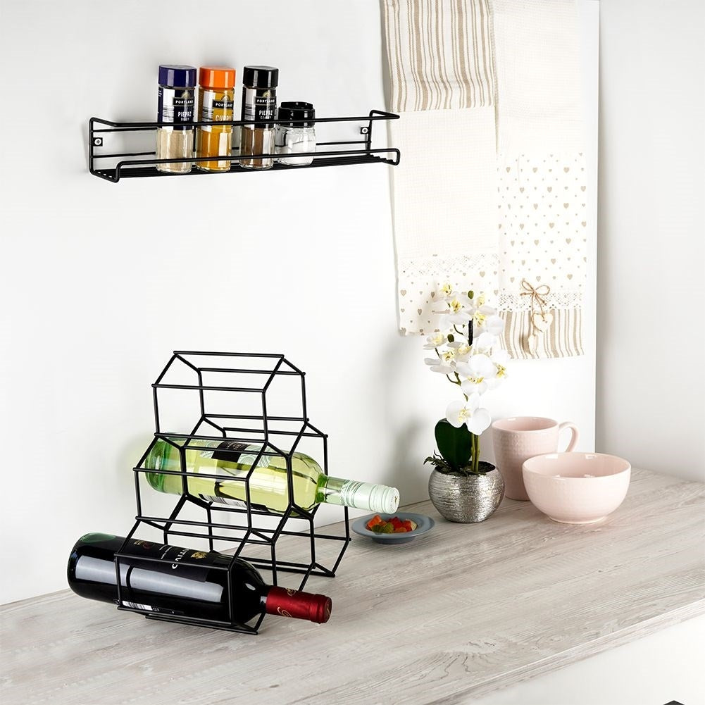 Wall-mounted black metal shelf for spices and cosmetics