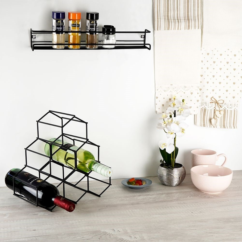 Wall-mounted black metal shelf for spices and cosmetics