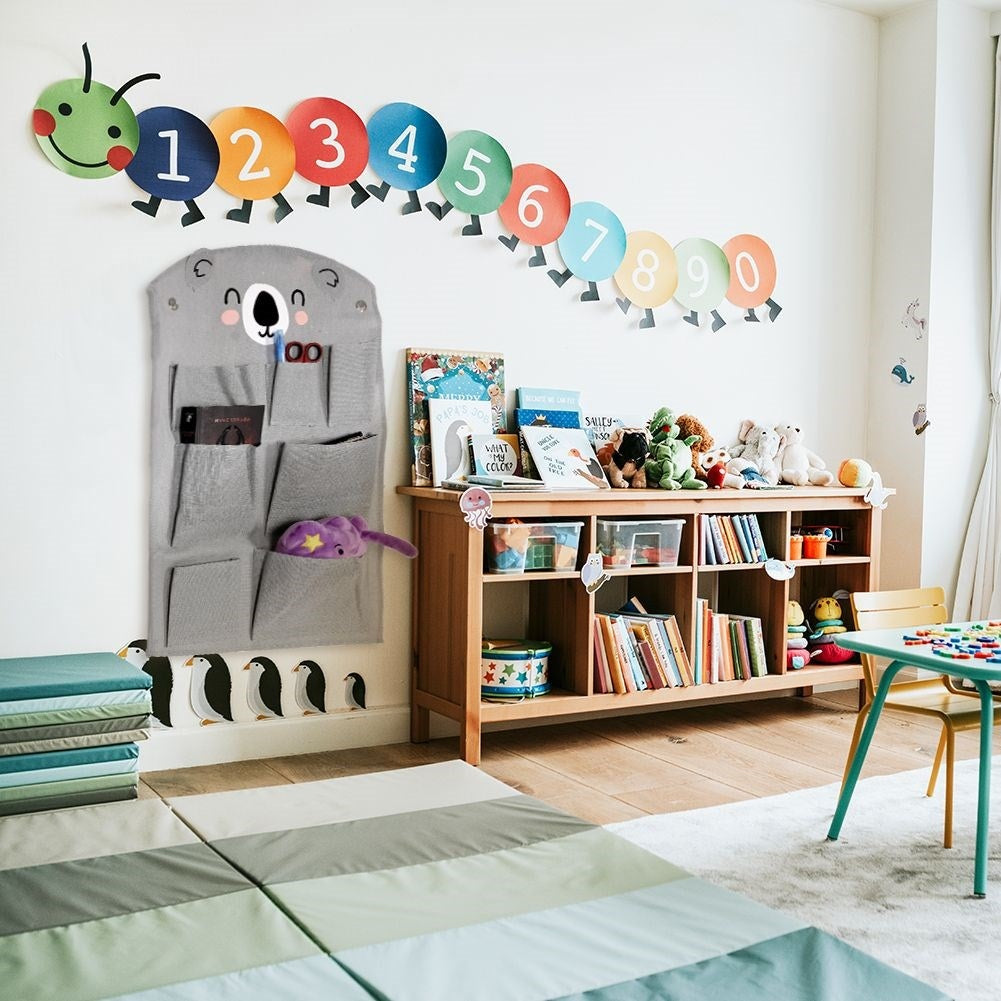 Wall organizer with koala motif and seven pockets for children