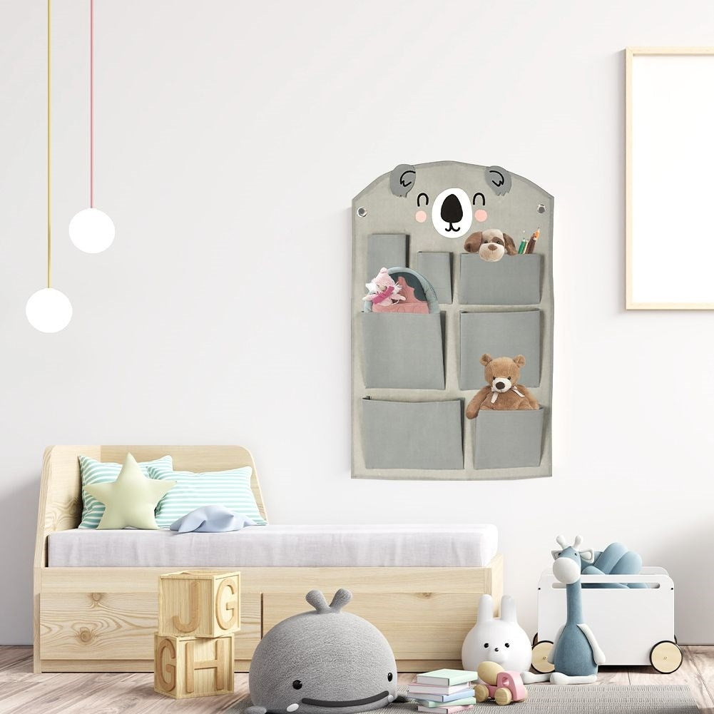 Wall organizer with koala motif and seven pockets for children