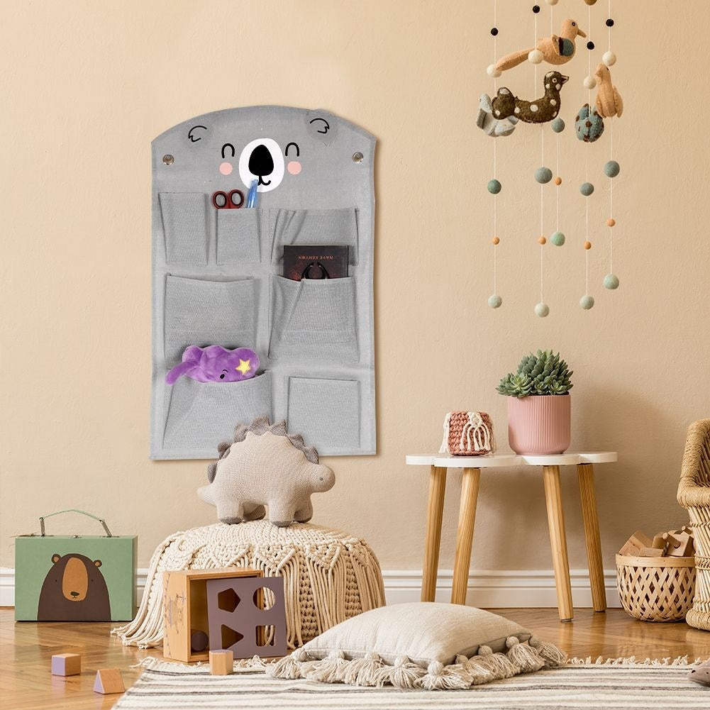 Wall organizer with koala motif and seven pockets for children