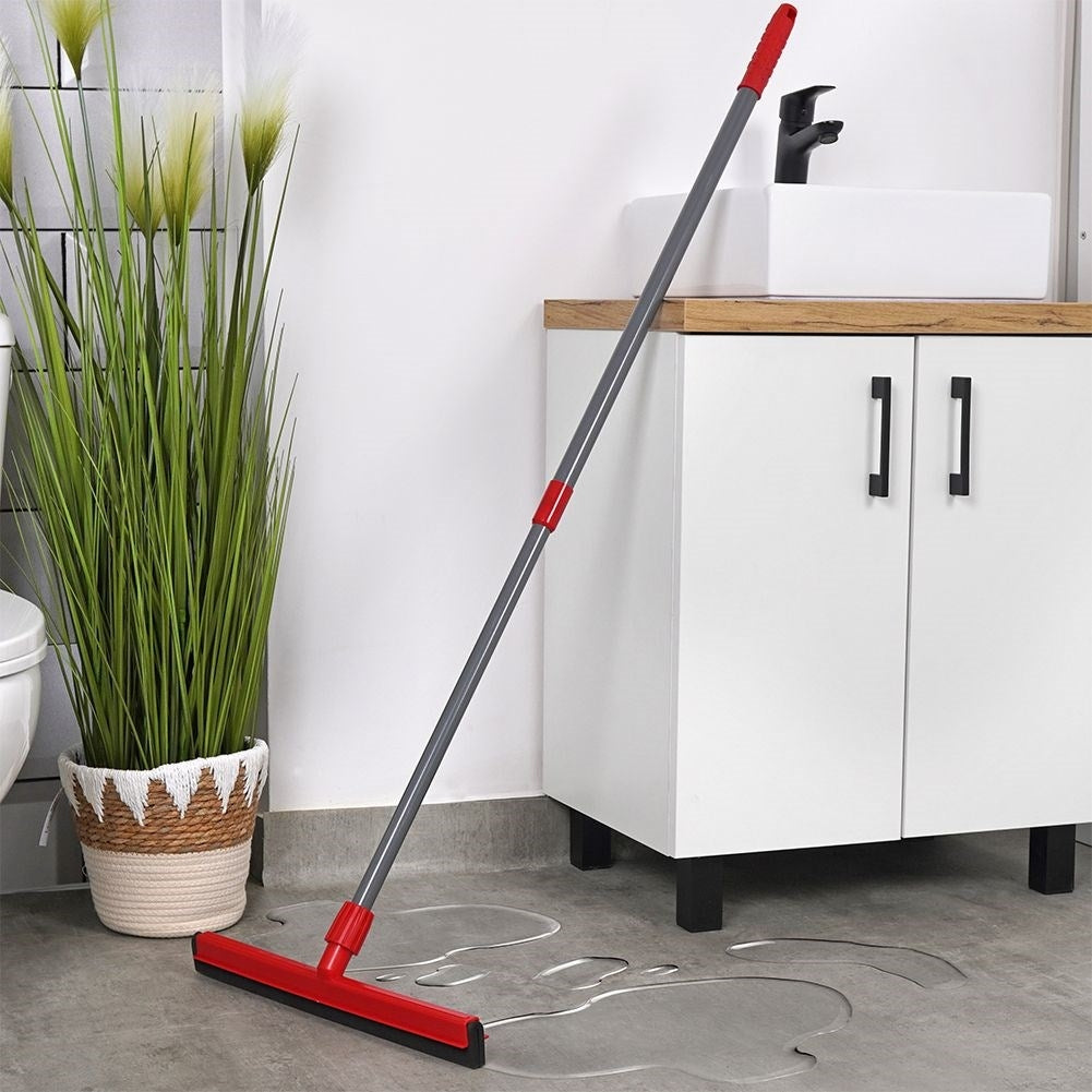 Water scraper with telescopic handle for floors