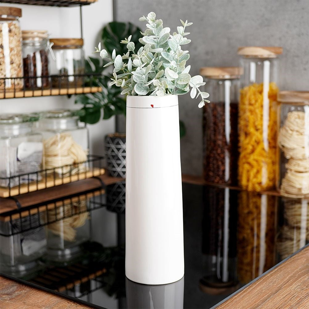 White ceramic vase with subtle floral heart motif