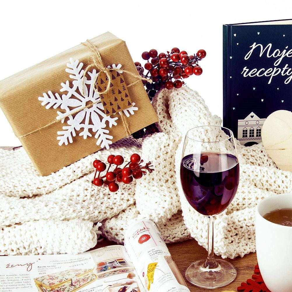 White felt coasters in snowflake shape for glasses and pans