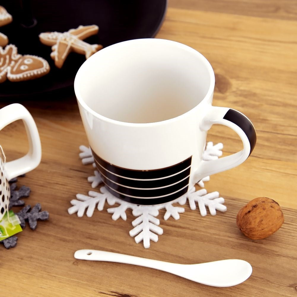 White felt coasters in snowflake shape for glasses and pans