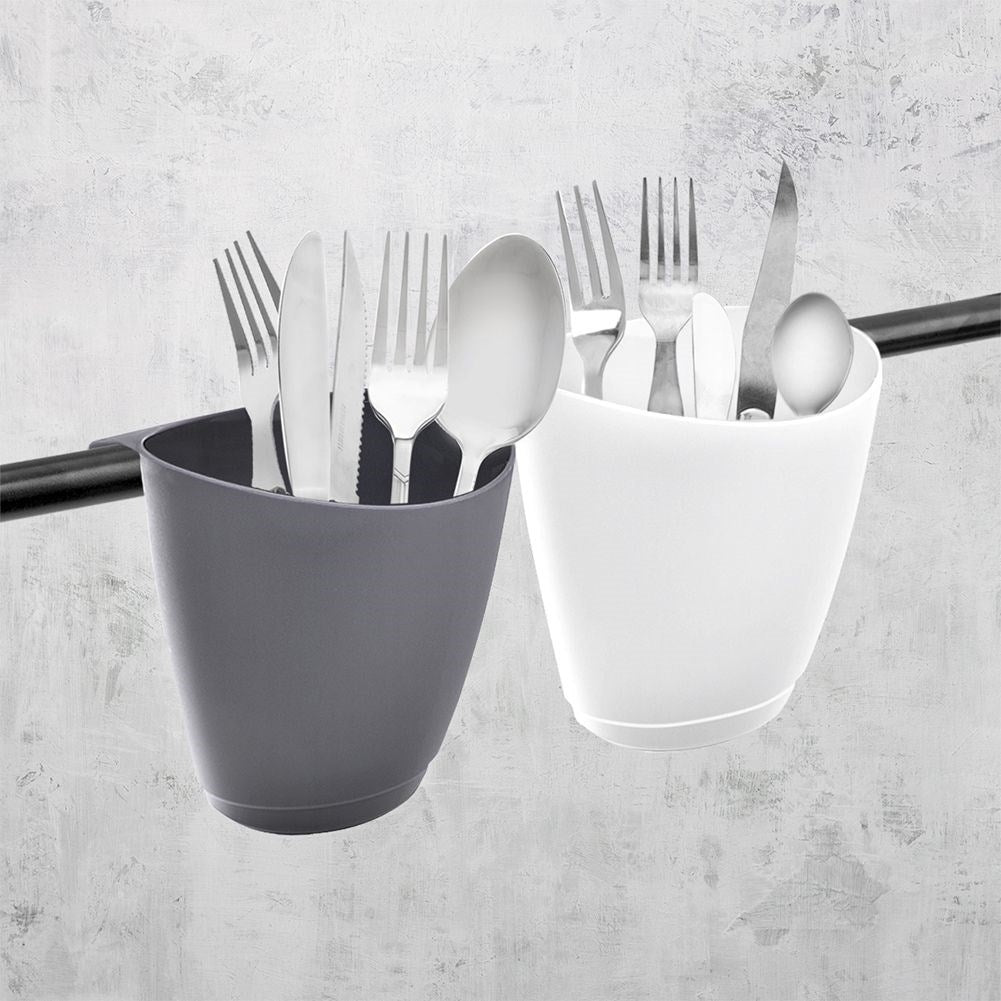 White plastic container for cutlery, drain and railing