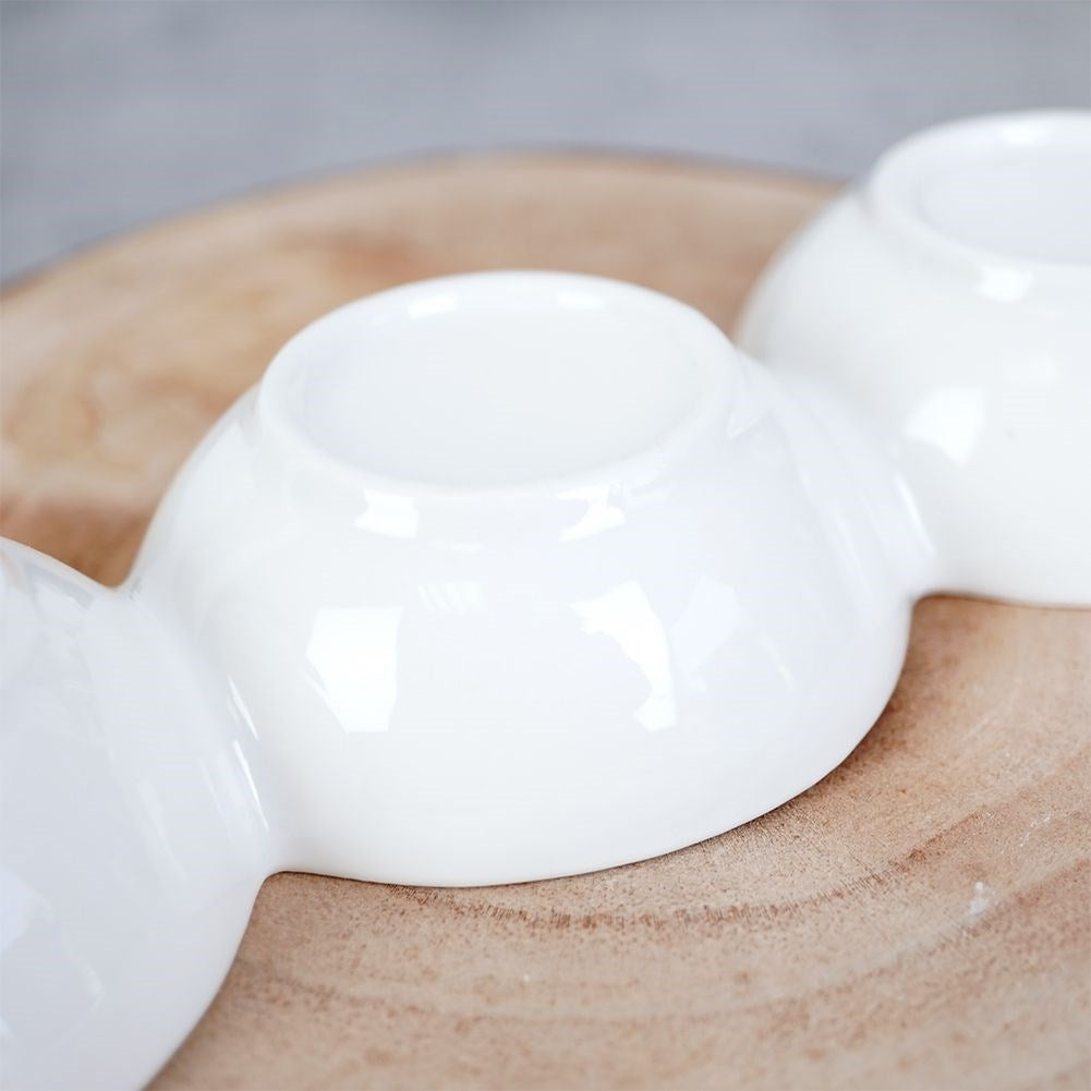 White porcelain bowl with three compartments for snacks and dip